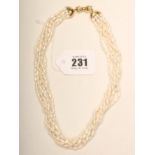 A FRESH WATER PEARL ROPE NECKLACE, the six strings twisted to an 18ct gold bow clasp (Est. plus