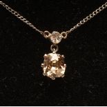 A SOLITAIRE DIAMOND PENDANT, the old mixed cut stone of approximately 1ct, claw set to a small