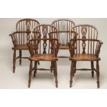 A SET OF FOUR ASH AND ELM WINDSOR ARMCHAIRS, 19th century, of low double hoop form with shaped and