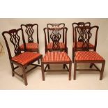 A SET OF SIX GEORGIAN MAHOGANY DINING CHAIRS, late 18th century, the waved scroll carved top rail on