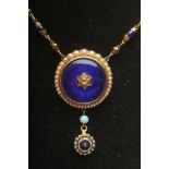 A VICTORIAN NECKLACE, the link and ball chain with ten blue bead spacers and fixed to a blue