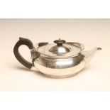A BACHELOR'S SILVER TEAPOT, makers W & C Sissons, Sheffield 1913, of prow form, the flat hinged