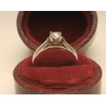 A SOLITAIRE DIAMOND RING, the brilliant cut stone of 0.26cts, claw set to a plain platinum shank,