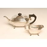 AN ART DECO SILVER TEAPOT AND MILK JUG, maker's mark JR, Birmingham 1931, of canted oblong form, the