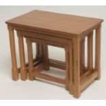 A NEST OF THREE ADZED OAK TABLES by Robert Thompson, of oblong form raised on chamfered