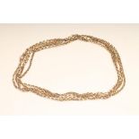 A 9CT GOLD GUARD CHAIN, with dog-clip fastener, 56" long, 28.1g (Est. plus 18% premium inc. VAT)