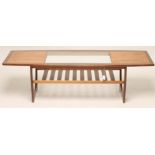 A G PLAN TEAK COFFEE TABLE, 1970's, the mildly eliptical top with central inset clear glass panel,