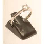 A SOLITAIRE DIAMOND RING, the brilliant cut stone of approximately 0.25cts, claw set to a plain