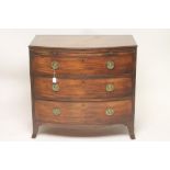 A GEORGIAN MAHOGANY CHEST, late 18th century, of bowed form with ebony stringing, the moulded