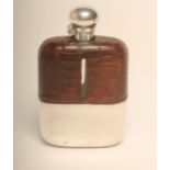 A LARGE EDWARDIAN PLATED HUNTING FLASK, the leather bound glass body with removable cup and twist