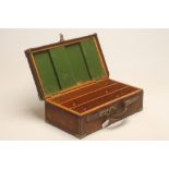 A SHOTGUN CARTRIDGE CASE, mid 20th century, the oak body bound in canvas, baize lined and fitted