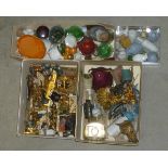 A collection of dolls house equipment in metal, wood and ceramic including furniture, table ware and