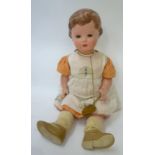 A Rheinische Gummi celluloid doll with blue glass sleeping eyes, painted mouth and hair, swivel