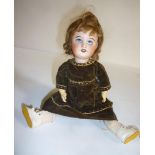 A French SFBJ bisque head doll with blue glass sleeping eyes, open mouth and teeth, brown mohair