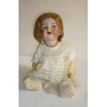 A Kammer & Reinhardt bisque head flirty eyed doll with blue glass sleeping eyes, open mouth, brown