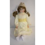 A Bahr & Prothschild bisque shoulder head doll with blue glass sleeping eyes, open mouth and