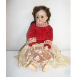 A Kammer & Reinhardt bisque head doll with brown glass sleeping eyes, open mouth and teeth,