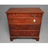 A GEORGIAN MAHOGANY CHEST, c.1800, the moulded edged top with stringing, four graduated drawers with