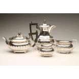 A LATE VICTORIAN SILVER FOUR PIECE TEA AND COFFEE SERVICE, maker Walker & Hall, Sheffield 1897, of