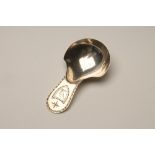 A GEORGE III SILVER CADDY SPOON, maker George Smith, London 1785 (incuse duty mark), with shield