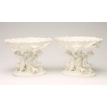 A PAIR OF MOORE BROS. WHITE GLAZED PORCELAIN PEDESTAL TAZZE, c.1890, the oval shallow dishes issuing