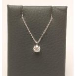 A TIFFANY SOLITAIRE DIAMOND PENDANT, the round brilliant cut stone of approximately 0.40cts, claw