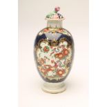 A FIRST PERIOD WORCESTER PORCELAIN TEA CANISTER, c.1770, of ovoid form, painted with kakiemon enamel