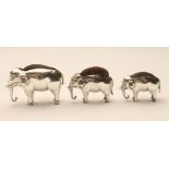 THREE GRADUATED SILVER NOVELTY ELEPHANT PIN CUSHIONS, maker Adie & Lovekin, Birmingham 1905/6/22,