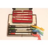 TWO SETS OF SILVER BRIDGE PENCILS, one set stamped Sterling Silver, of hexagonal form with green,