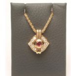 A RUBY AND DIAMOND PENDANT, the oval cut Burma ruby centrally claw set to an open lozenge panel