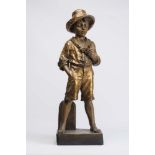 A LARGE GOLDSCHEIDER EARTHENWARE FIGURE, late 19th century, modelled as a young boy wearing a hat,