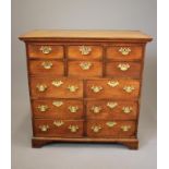 AN OAK CHEST, part 18th century, the moulded cornice over six small drawers, six larger drawers