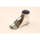 A LATE VICTORIAN SILVER NOVELTY FOOT PIN CUSHION, maker B.H. Joseph, Chester 1895, 2 1/2" long (Est.