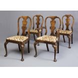 A SET OF EIGHT WALNUT DINING CHAIRS including two elbow chairs, of Georgian design, early 20th