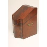 A GEORGIAN MAHOGANY KNIFE BOX, c.1800, of serpentine form with herringbone strung angles and two