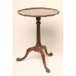 A MAHOGANY TRIPOD TABLE of Georgian design, c.1900, the circular top with pie crust edging, baluster