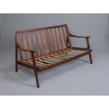 A DANISH TEAK FRAMED SOFA, 1960'S, the slatted raked back with straight top rail, shaped open arms