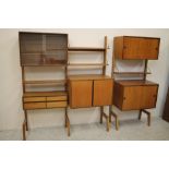 A DANISH TEAK ROOM UNIT by Kai Kristiansen in two sections, the square wooden uprights and metal