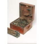 A BRASS THEODOLITE by Elliot Bros., London, with accessories, in fitted mahogany case with loop