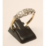 A FIVE STONE DIAMOND RING, the illusion set stones to a plain 18ct gold shank, size S (Est. plus 18%