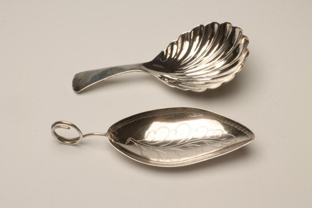A LATE GEORGE III SILVER CADDY SPOON, maker's mark mis-struck, London 1796, the leaf shaped bowl