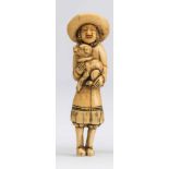 A JAPANESE IVORY NETSUKE, 18th century, carved as a Dutchman, standing holding a puppy in his