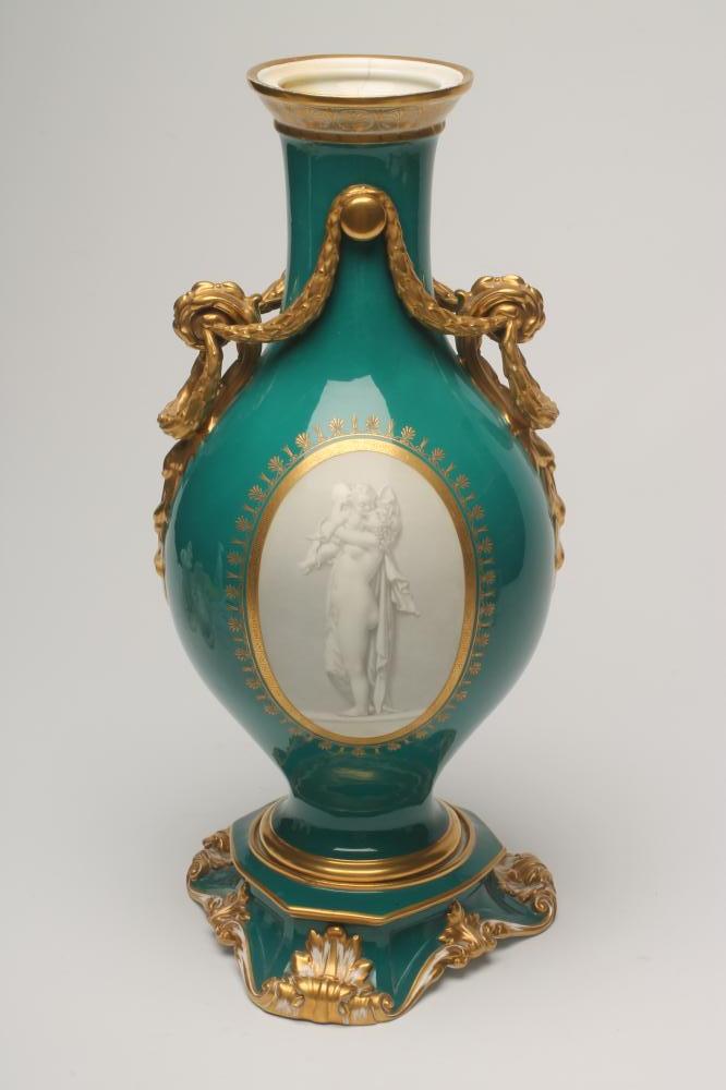 A FRENCH PORCELAIN GARNITURE VASE, mid 19th century, of baluster form, the two scroll handles tied