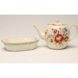 A LEEDS CREAMWARE TEAPOT AND COVER, c..1810, of rounded form with plain pulled handle, painted in