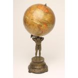 A "GEOGRAPHIA" 8" "TERRESTRIAL GLOBE", - supported by Atlas, standing barefoot on a flared