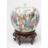 A CHINESE PORCELAIN JAR AND COVER of ovoid form, painted in famille rose enamels with children