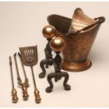 A PAIR OF ANDIRONS, c.1900, with large copper ball finial on wrythen turned iron upright, raised