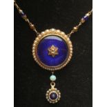 A VICTORIAN NECKLACE, the link and ball chain with ten blue bead spacers and fixed to a blue