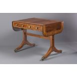 A GEORGIAN MAHOGANY SOFA TABLE, early 19th century, the rounded oblong top banded in satinwood,