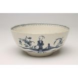 A FIRST PERIOD WORCESTER "WAITING CHINAMAN" PATTERN PORCELAIN BOWL, c.1775, painted in underglaze